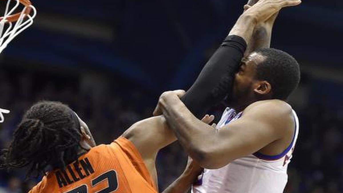 
Kansas’ Cliff Alexander had a monster dunk over Oklahoma State’s Anthony Allen during Monday night’s game.
