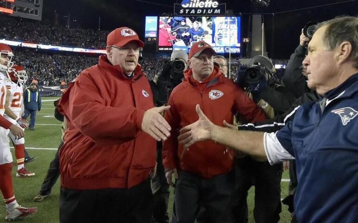 Chiefs coach Andy Reid shakes hands with New England nemesis Bill Belichick after the Patriots’ 27-20 playoff win in January 2016 at Foxborough, Mass.