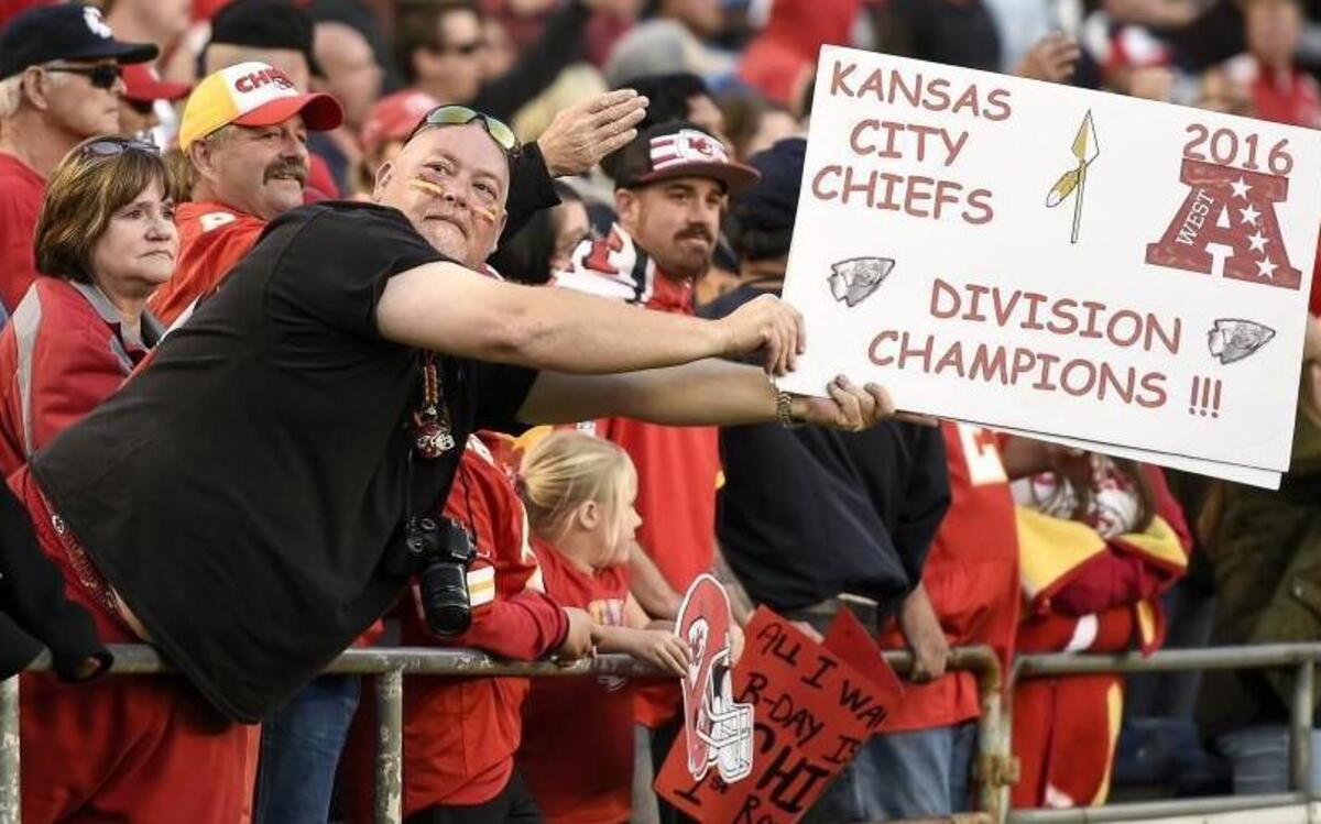 A Kansas City Chiefs fan held up a sign boasting on the team winning the AFC West division with a 37-27 win over the Chargers on January 1, 2017 at Qualcomm Stadium in San Diego.