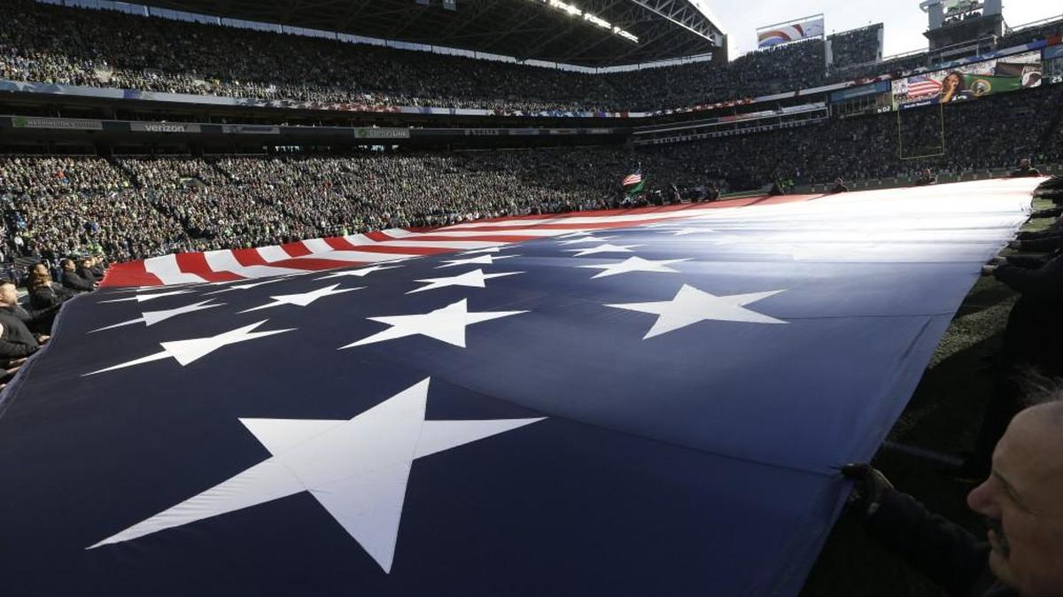 A giant U.S. flag was displayed at CenturyLink Field during the singing of the national anthem before a game last year between the Seattle Seahawks and the Arizona Cardinals.