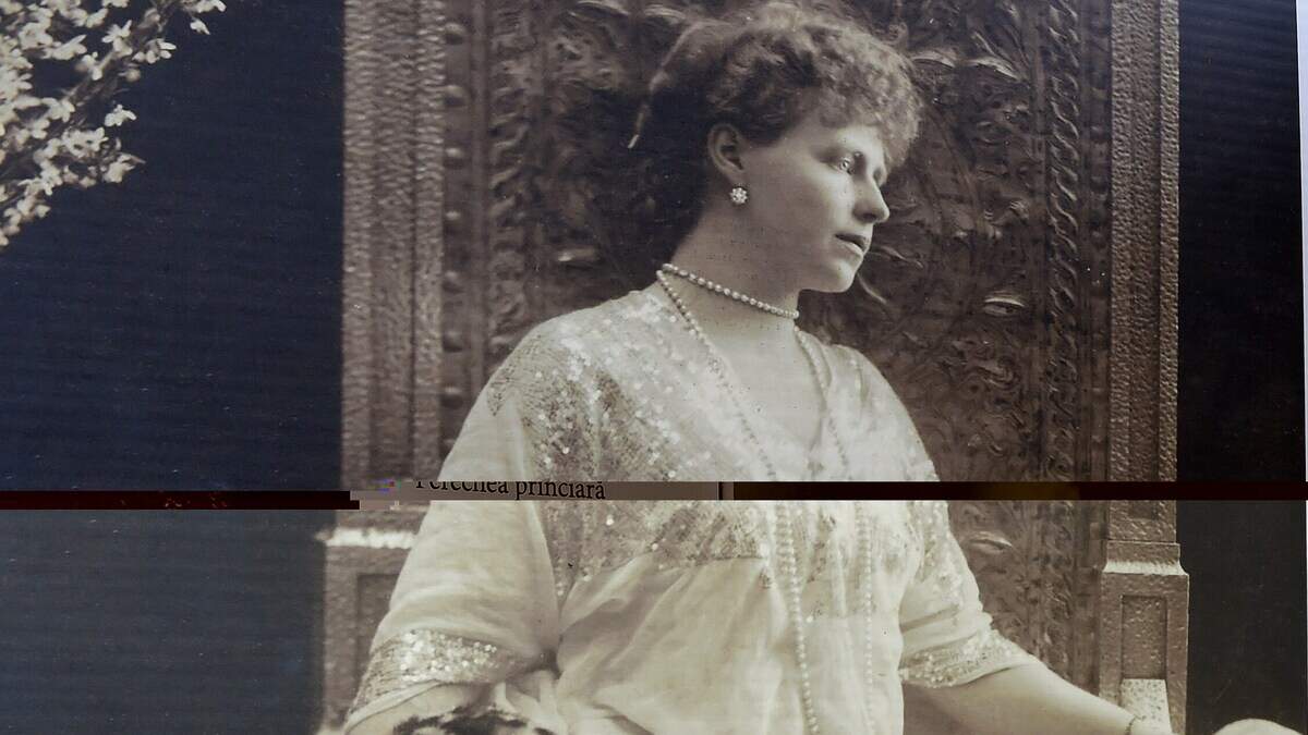 Portraits of Queen Marie of Romania are seen at an exhibition outside the National History Museum in Bucharest Oct. 2, 2015.