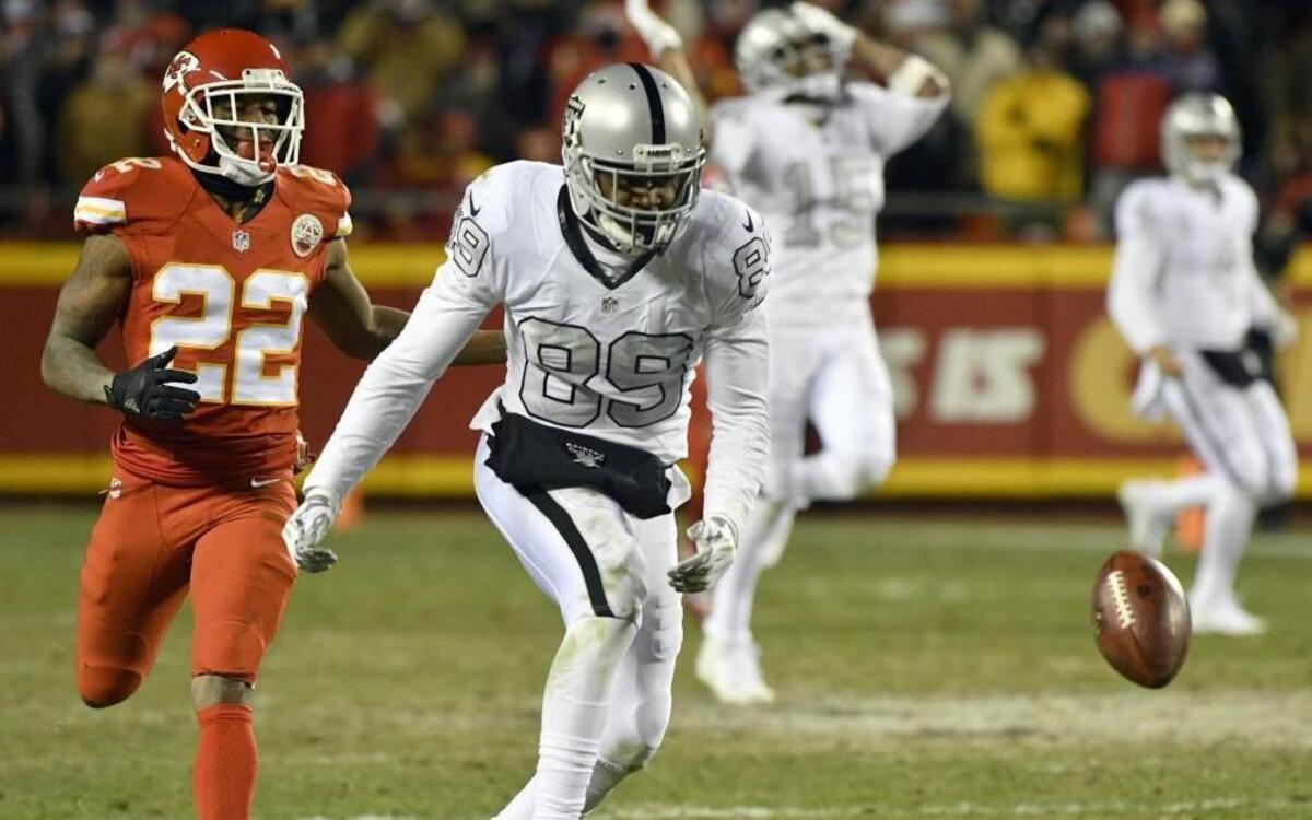 Oakland Raiders wide receiver Amari Cooper failed to reach a pass from quarterback Derek Carr with Kansas City Chiefs defensive back Marcus Peters running behind him during the second half of Thursday’s game.