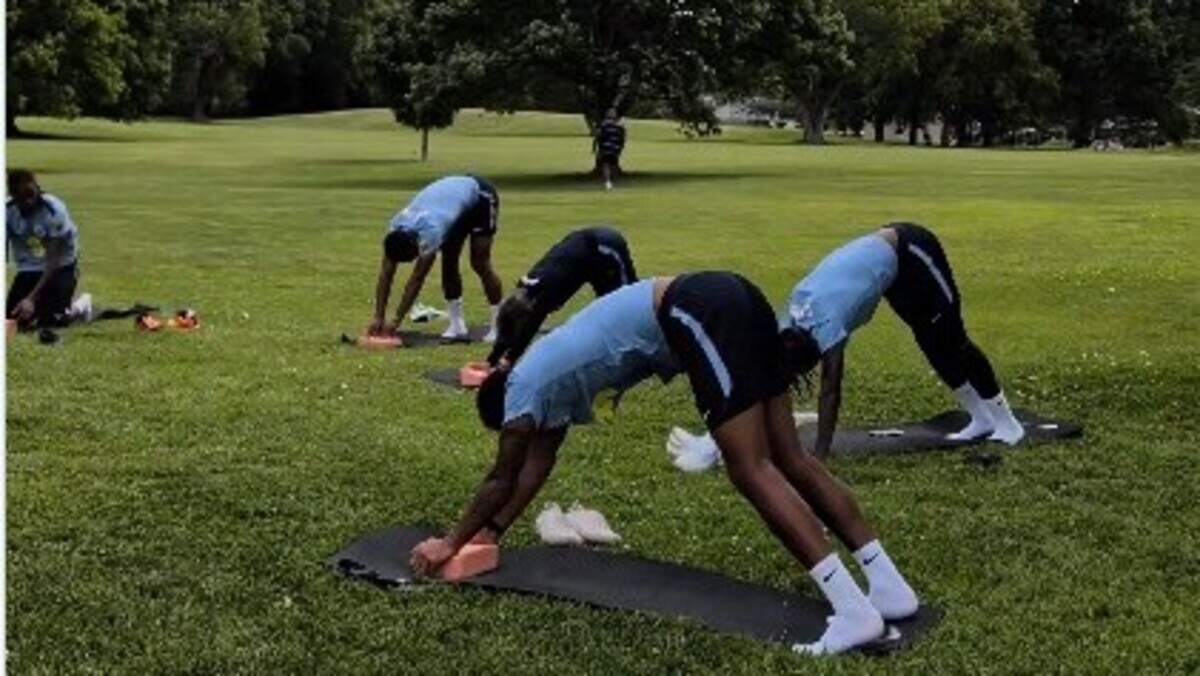 How to come down from a World Cup match? How about some team yoga in the park?