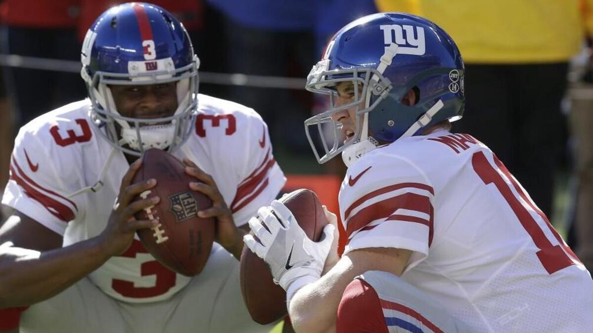 New York Giants quarterbacks Geno Smith (left) and Eli Manning warmed up before a game earlier this month.