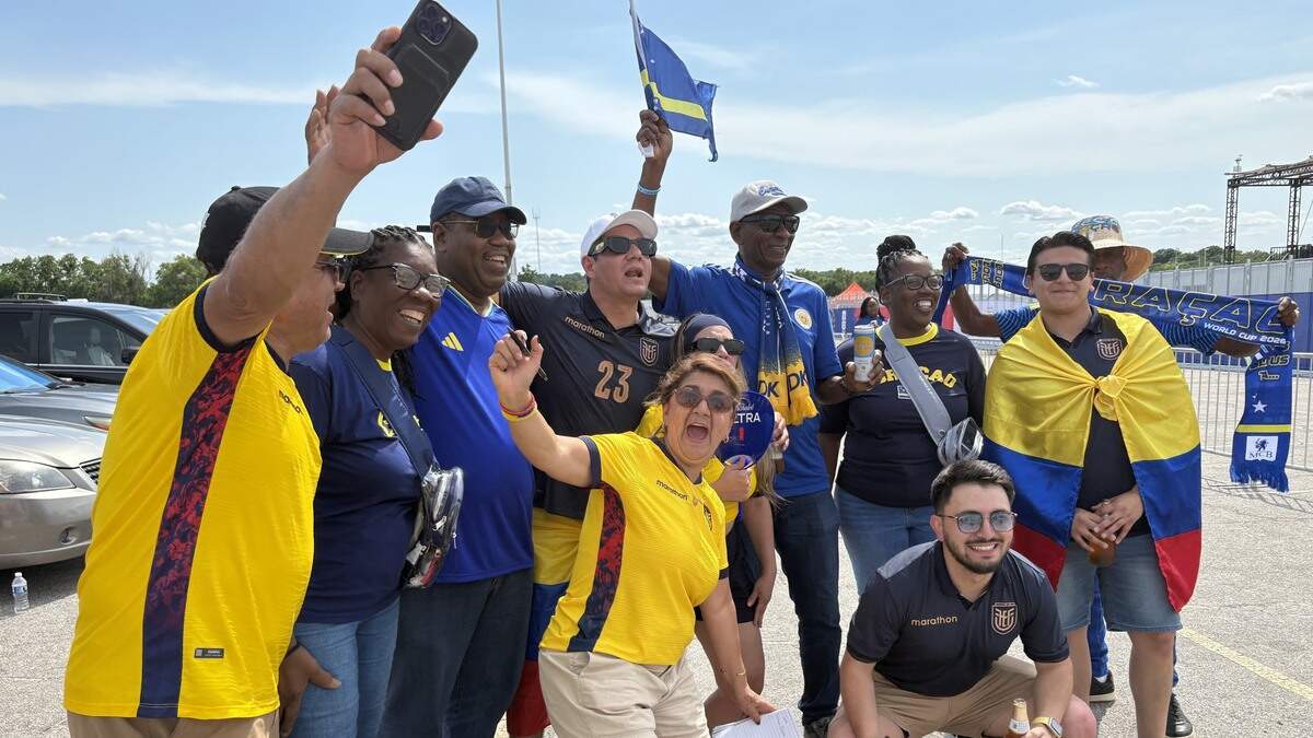 Fans from Quito, Ecuador were tailgating at Arrowhead Stadium on Saturday when the stopped to take a photo with supporters of Curaçao.