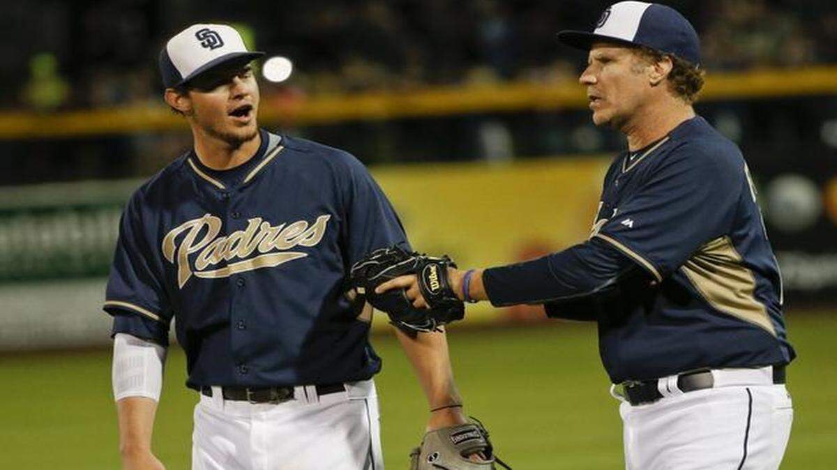
Actor Will Ferrell talks with San Diego Padres center fielder Wil Myers as the pair come off the field following an inning in which Ferrell played right field for the Padres in a spring training baseball game against the Dodgers in Peoria, Ariz. 
