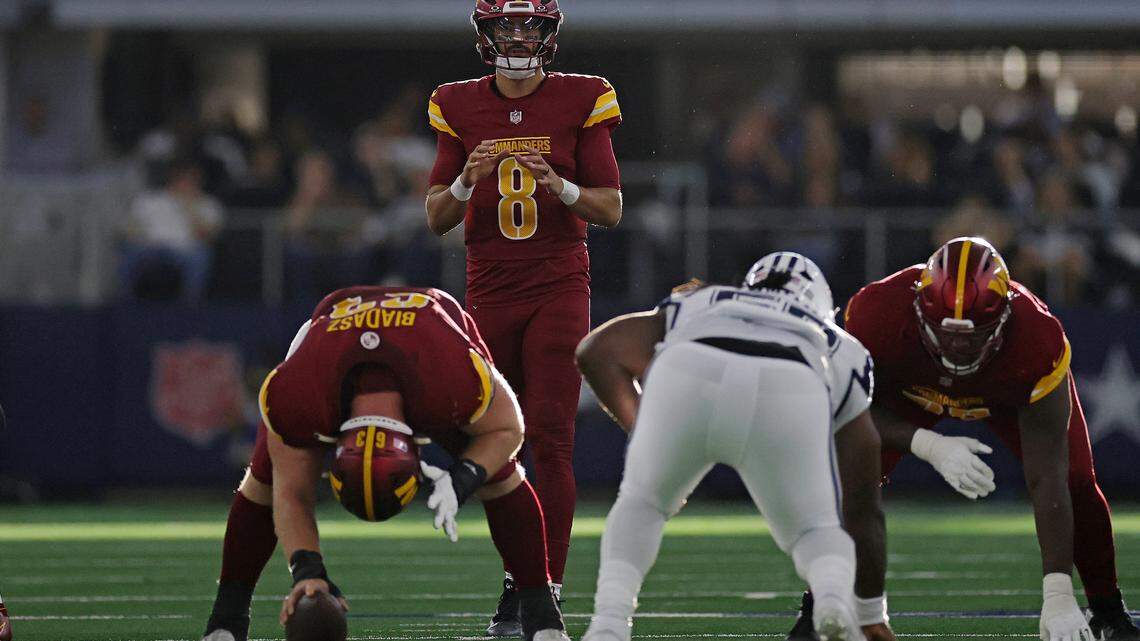 Marcus Mariota #8 of the Washington Commanders calls a play during the second half against the Dallas Cowboys at AT&T Stadium on October 19, 2025 in Arlington, Texas.