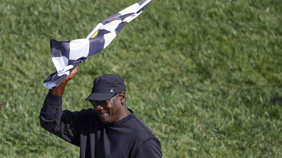 Michael Jordan, NBA Hall of Famer and co-owner of 23XI Racing celebrate d,with the checkered flag after his driver, Tyler Reddick, won the NASCAR Cup Series AdventHealth 400 at Kansas Speedway on April 19, 2026 in Kansas City, Kansas.