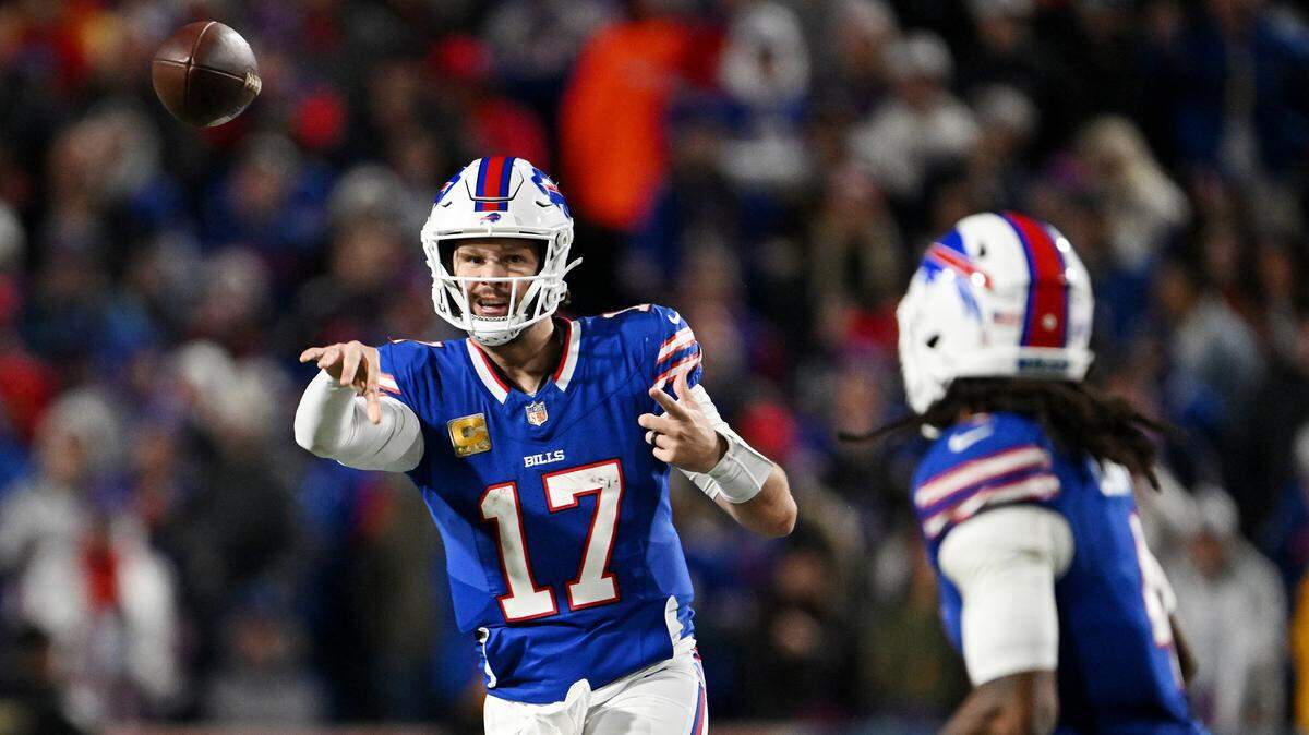 Josh Allen of the Buffalo Bills threw a pass to James Cook during the fourth quarter of Sunday’s game against the Kansas City Chiefs at Highmark Stadium on Sunday in Orchard Park, New York.