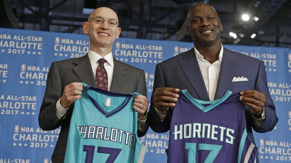 In this June 23, 2015 file photo, NBA commissioner Adam Silver and Charlotte Hornets owner Michael Jordan posed for a photo during a news conference to announce Charlotte, N.C., as the site of the 2017 NBA All-Star basketball game. The NBA is moving the 2017 All-Star Game out of Charlotte because of its objections to a North Carolina law that limits anti-discrimination protections for lesbian, gay and transgender people.