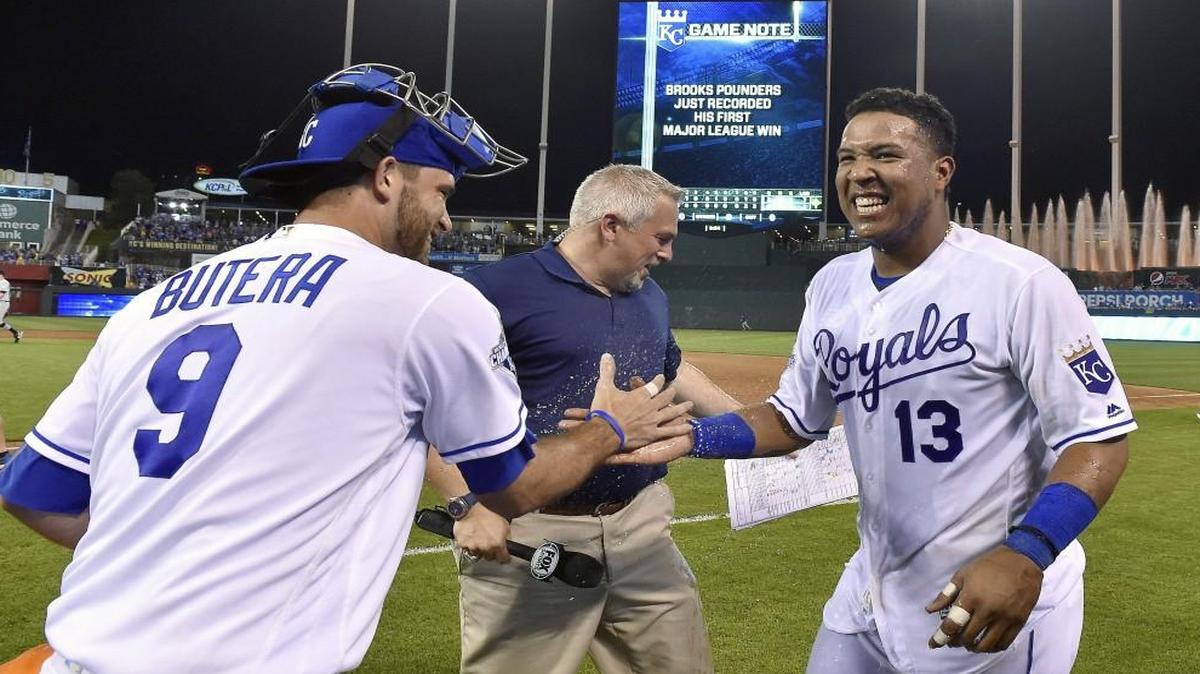 Kansas City Royals catcher Salvador Perez smiled after getting a Gatorade bucket shower from Drew Butera after a game in July.