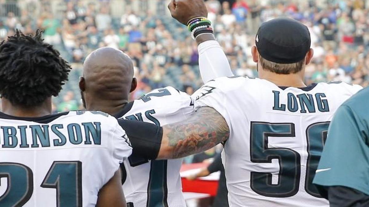 Philadelphia Eagles strong safety Malcolm Jenkins raised his fist and teammate defensive end Chris Long put his arm around Jenkins during the national anthem before a preseason game against the Buffalo Bills on Thursday.