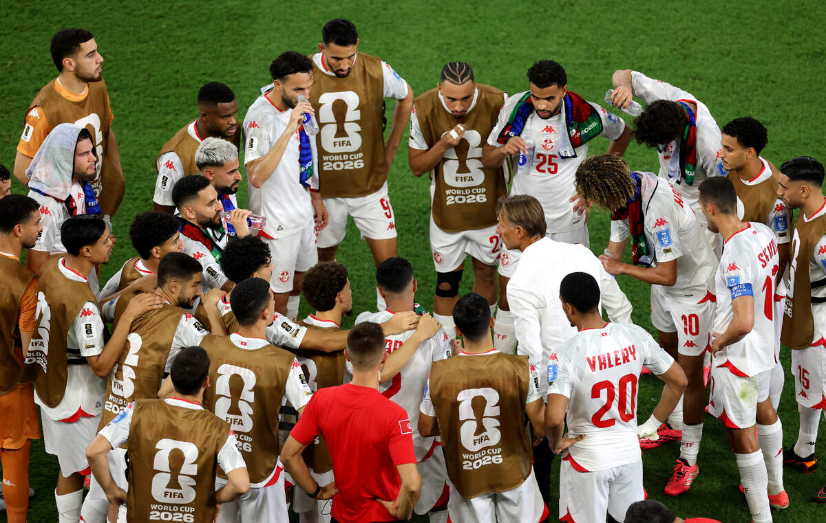 Tunisia national team soccer coach Hervé Renard addresses his players during a hydration break in a match against Japan at Monterrey Stadium in Guadalupe, Mexico on June 20, 2026.