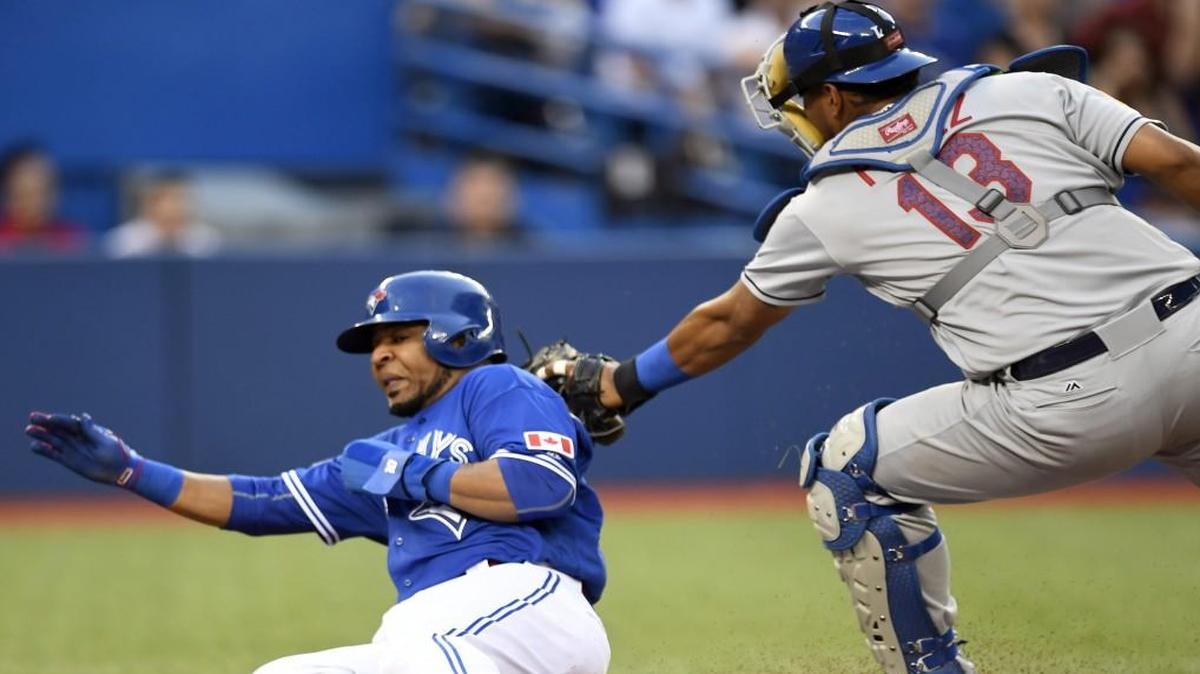 Toronto’s Edwin Encarnacion was tagged out at home plate by Kansas City Royals catcher Salvador Perez during the fourth inning of Monday’s game.