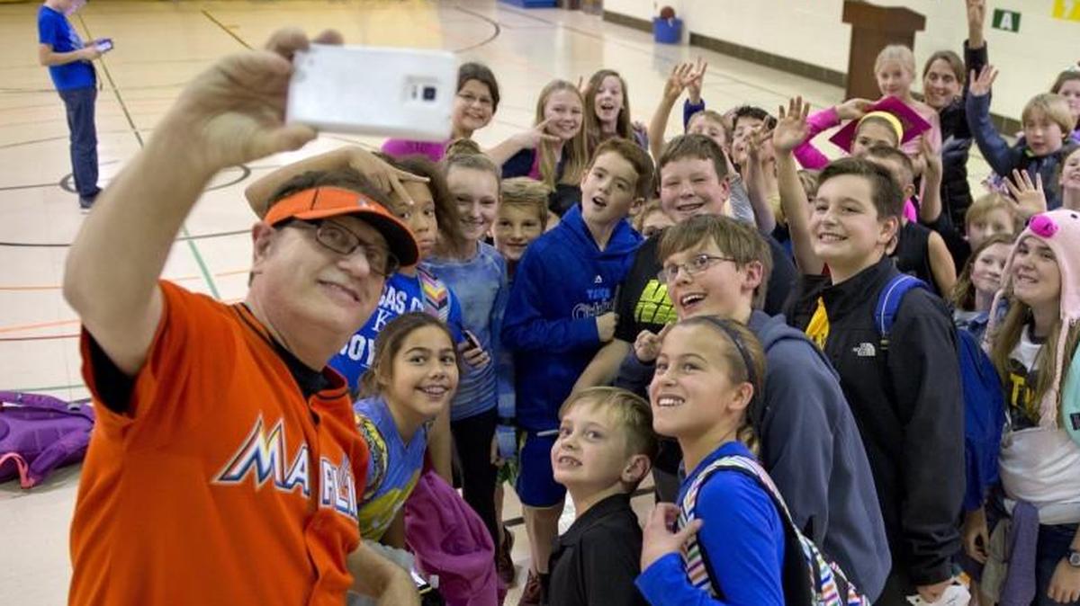 Marlins Man, aka Laurence Leavy, snapped a selfie with children from Trailwood Elementary School in 2015.