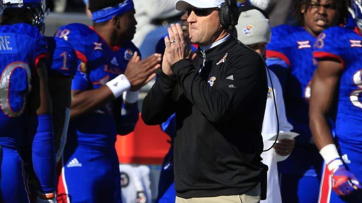 Kansas head coach David Beaty applauds his team during the first half of an NCAA college football game against Iowa State in Lawrence, Kan., Saturday, Nov. 12, 2016.