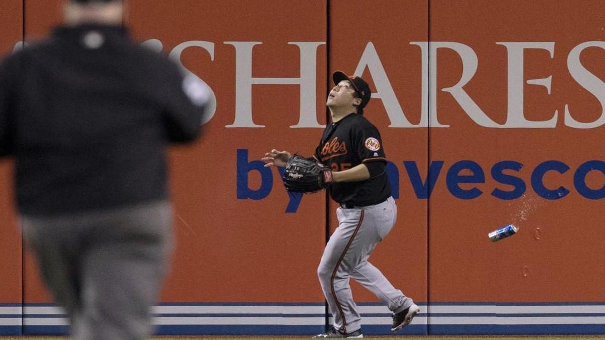 Baltimore Orioles left fielder Hyun Soo Kim got under a fly ball as a beer can fell near him during the seventh inning of an American League Wild Card Game against the Toronto Blue Jays in Toronto on Tuesday.