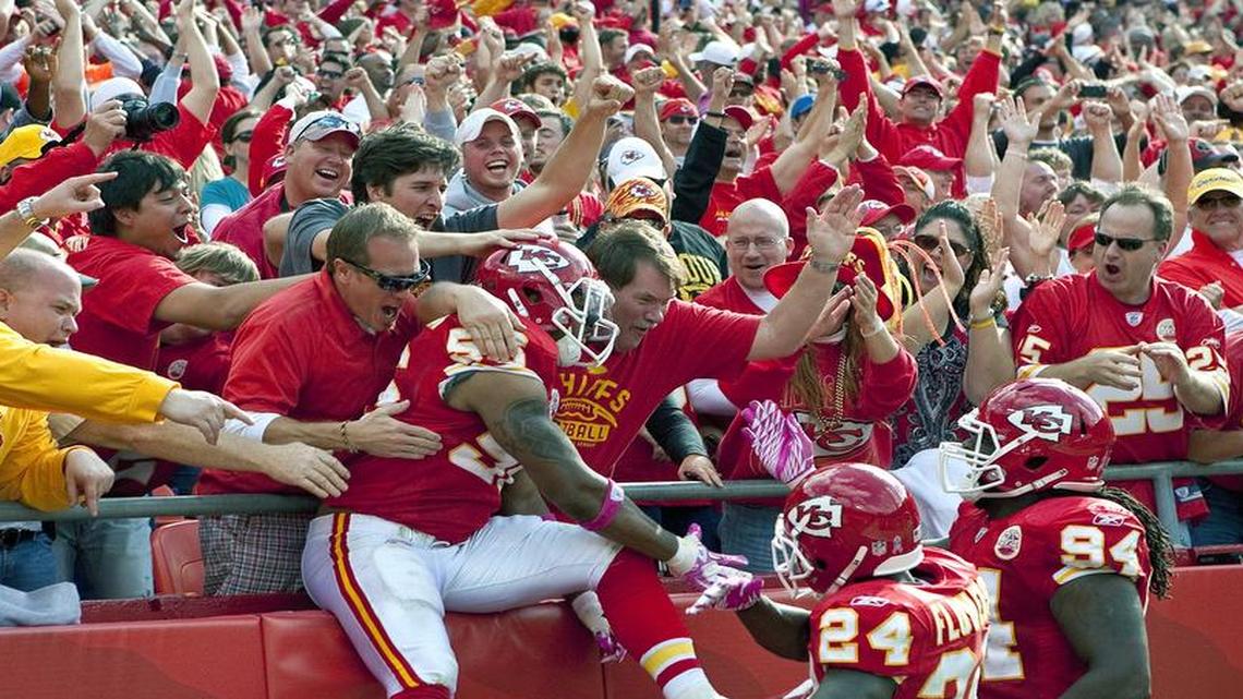 
Kansas City Chiefs linebacker Derrick Johnson celebrated with fans and teammates after scoring on an interception return.
