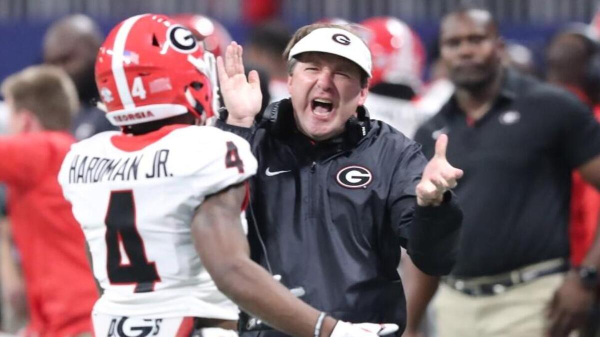 Georgia Bulldogs head coach Kirby Smart greeted wide receiver Mecole Hardman during the SEC Championship Game.