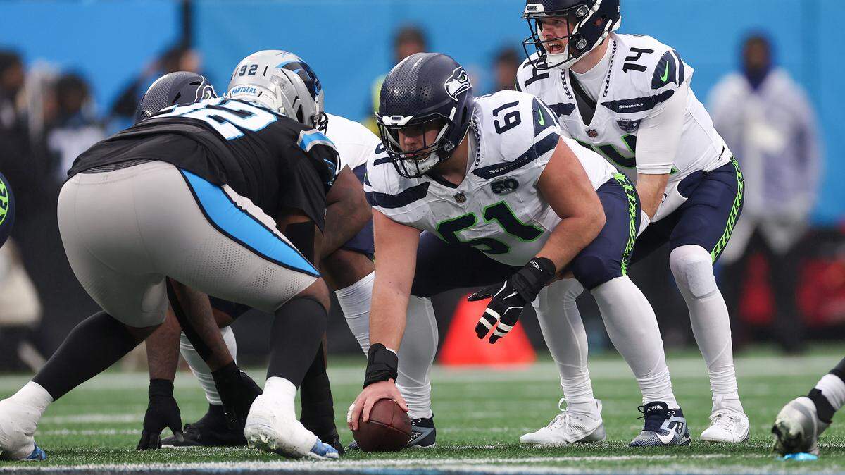 Jalen Sundell #61 of the Seattle Seahawks prepares to snap the ball during the second quarter against the Carolina Panthers at Bank of America Stadium on Dec. 28, 2025 in Charlotte, North Carolina.