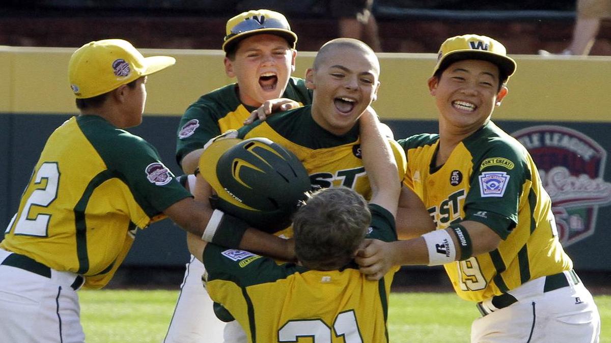 Huntington Beach, Calif.'s Nick Pratto, center, celebrated with teammates after driving in the winning run with a walk-off single off Hamamatsu City, Japan, pitcher Kazuto Takakura to win the Little League World Series Championship baseball game in South Williamsport, Pa., on Sunday, Aug. 28, 2011. California won 2-1.