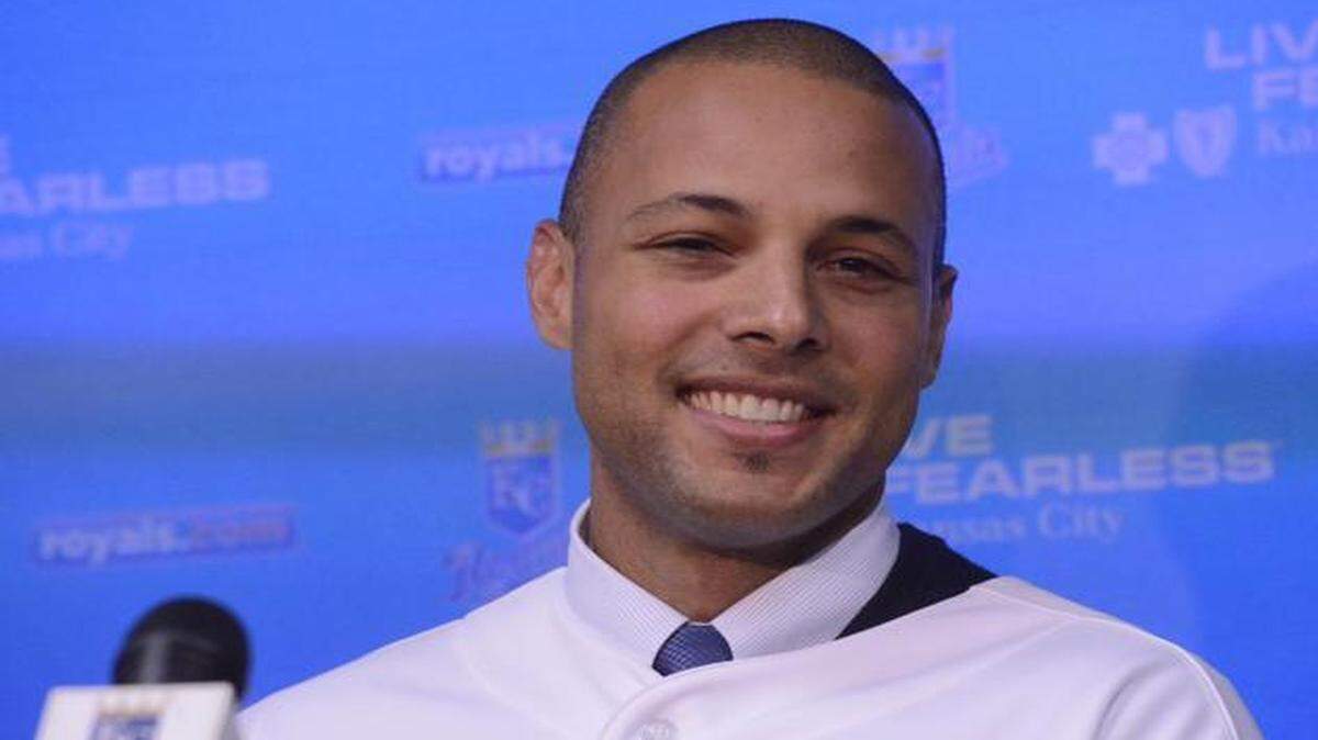 
Alex Rios smiled at a news conference announcing he had signed with the Kansas City Royals.
