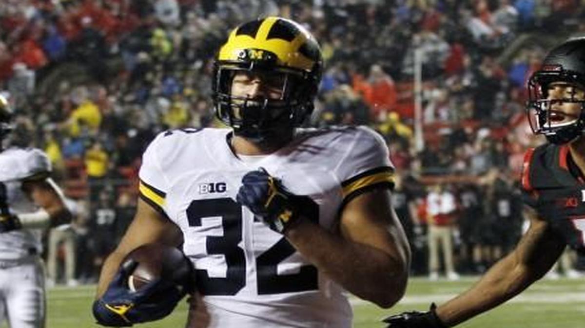 Rutgers defensive back Isaiah Wharton could not stop a touchdown by Michigan running back Ty Isaac during Saturday’s game. The Wolverines won 78-0.