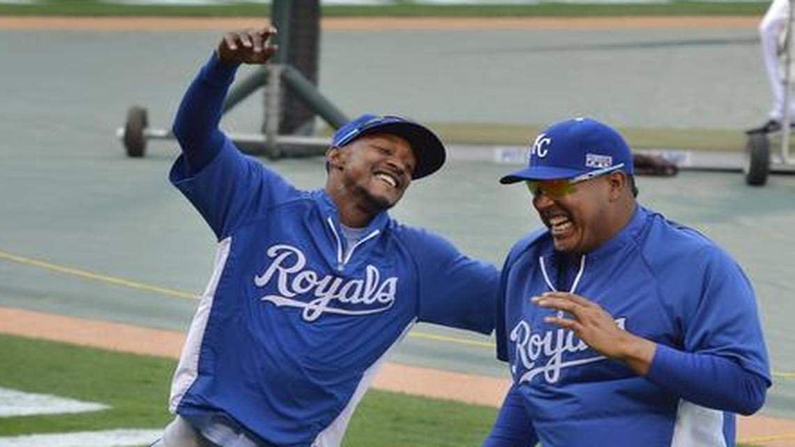 
Royals outfielder Jarrod Dyson, left, and catcher Salvador Perez stay loose during warm-ups before Friday night’s game two of the ALDS in Anaheim, Calif.
