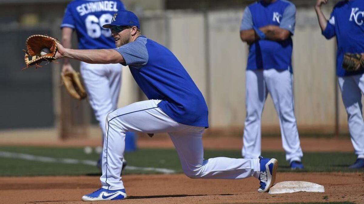 Kansas City Royals prospect Hunter Dozier catches a throw at first base during a spring training workout on February 22, 2018 in Surprise, Arizona.
