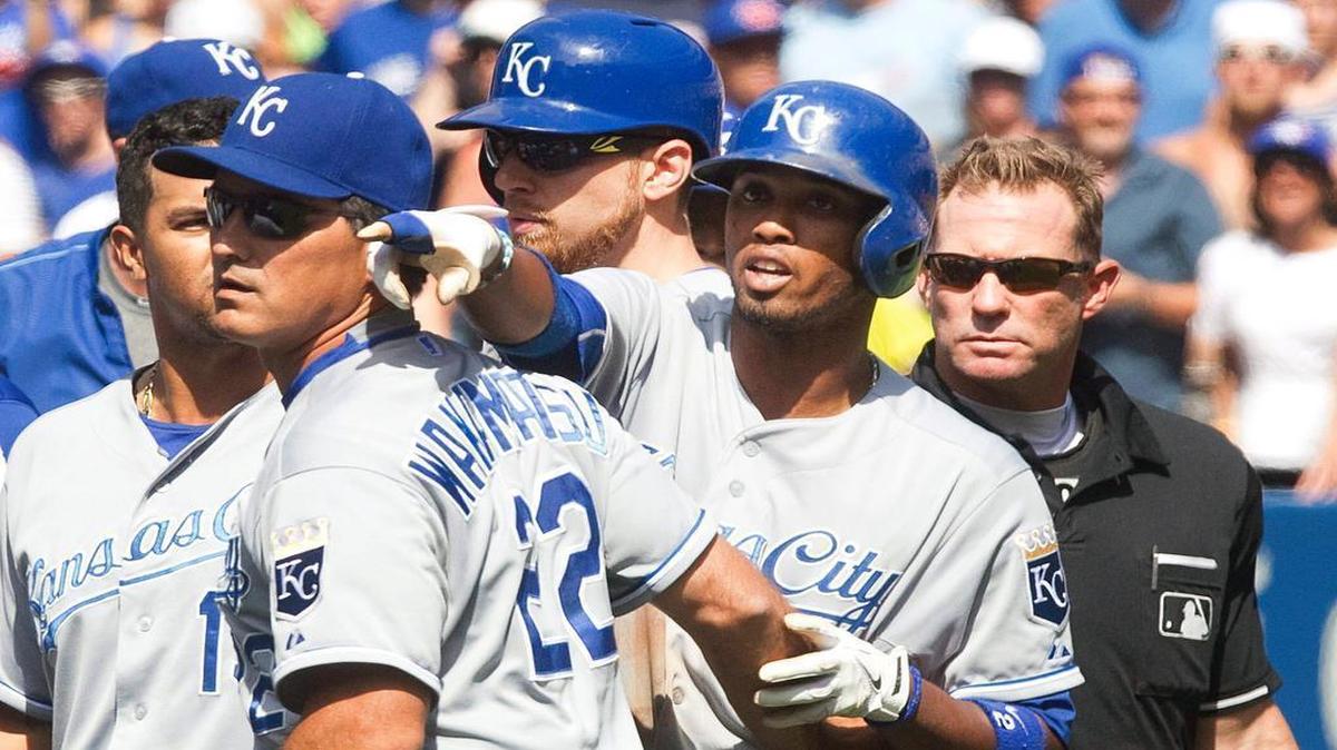 
Royals bench coach Don Wakamatsu (22) held back Alcides Escobar as Escobar gestured at Blue Jays pitcher Aaron Sanchez, who was ejected for hitting Escobar on Sunday in Toronto. The Blue Jays won the game 5-2.
