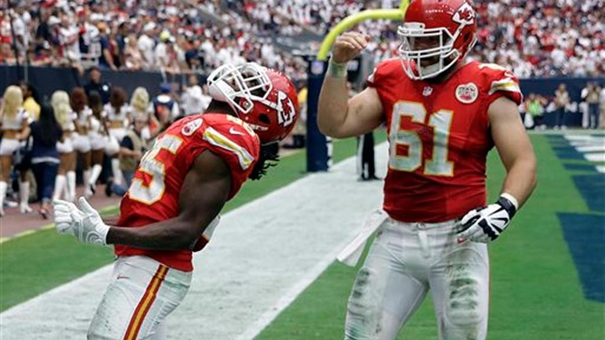 
Kansas City Chiefs running back Jamaal Charles (left) celebrated his touchdown against the Houston Texans with teammate Mitch Morse.
