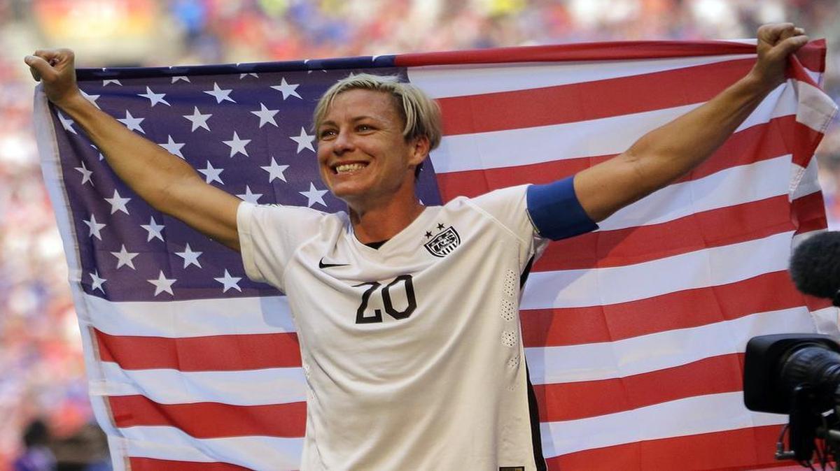 
Abby Wambach held a flag after the U.S. beat Japan 5-2 in the Women’s World Cup soccer championship in Vancouver, British Columbia.

