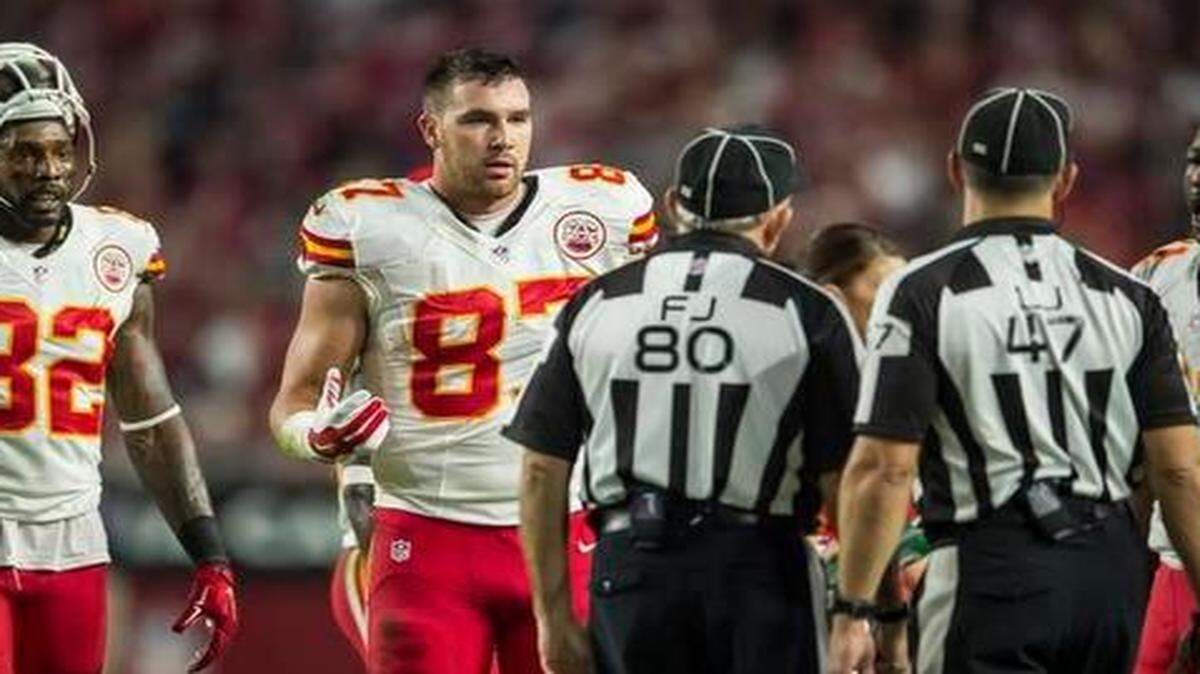 
Chiefs tight end Travis Kelce (center) spoke to referees during the official review after his catch-and-run that was ultimately ruled a fumble.
