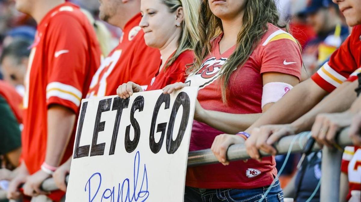 A Chiefs fan turned her sign around to show support for the Royals on Oct. 11 at Arrowhead Stadium.