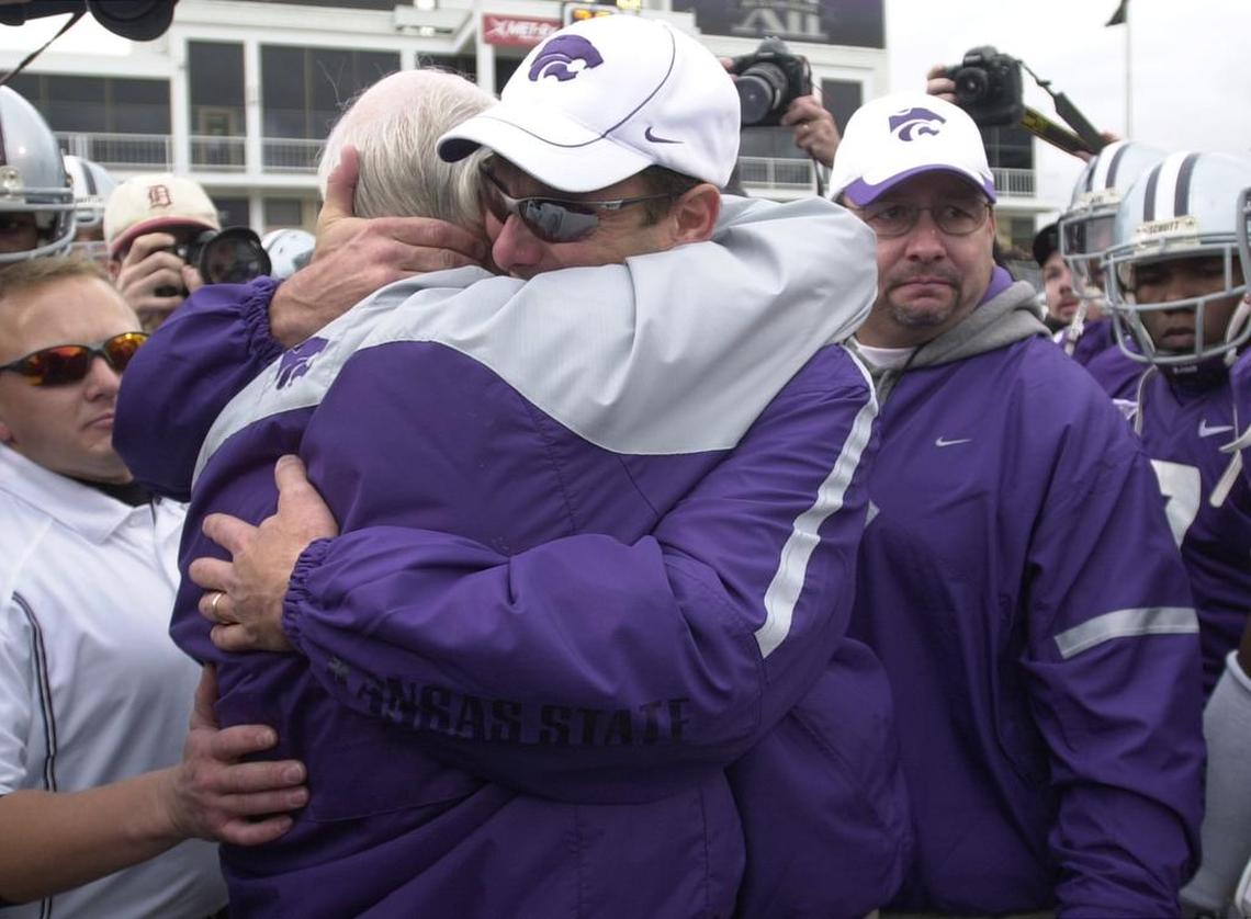 Kansas State University head coach Bill Snyder hugged his son, Sean, before the game against Missouri on Saturday, November 19, 2005, at Bill Snyder Family Stadium in Manhattan, Kan. Snyder retired after 17 years of coaching at the university, but he returned in 2009.