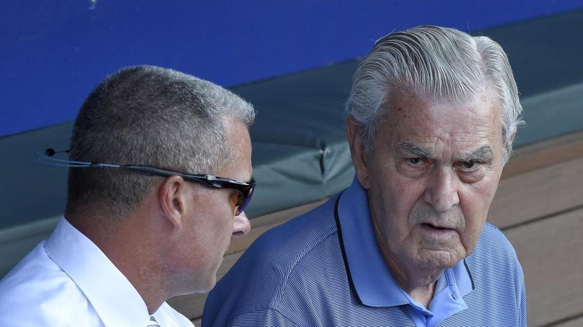 Royals owner David Glass, right, seems intent on keeping general manager Dayton Moore around. So now it’s time to take care of him.