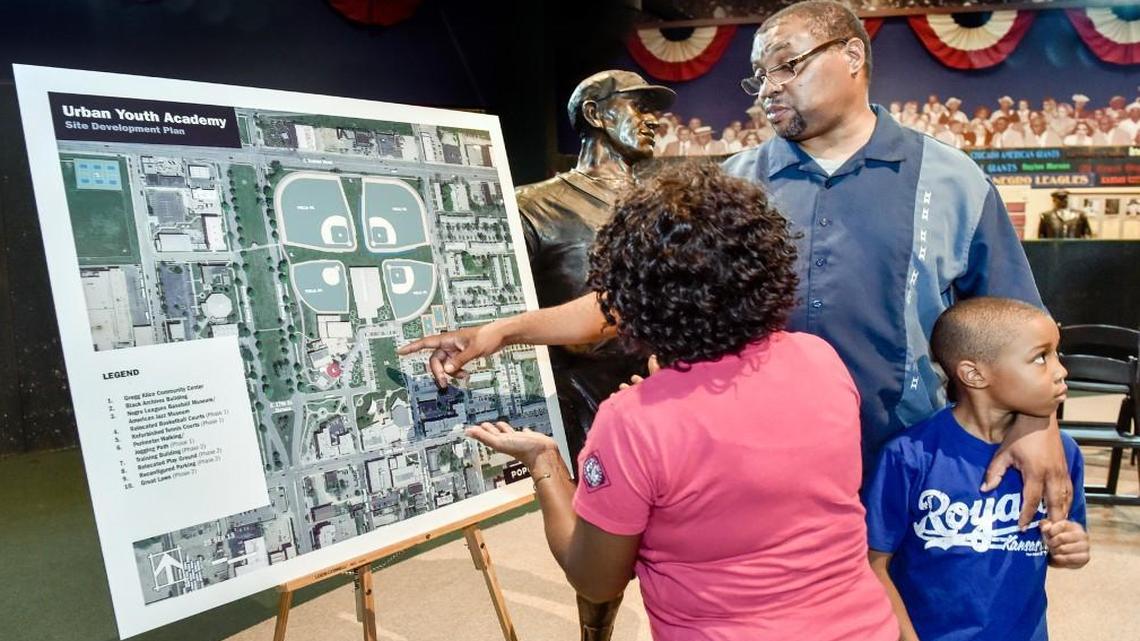 
Cathie Moss and Ray Doswell of the Negro Leagues Baseball Museum looked at plans Friday for the Kansas City Urban Youth Academy to be built and operated with help from the Royals. Doswell’s son Jordan, 7, was on hand for the announcement of the facility to be built at Parade Park. 


