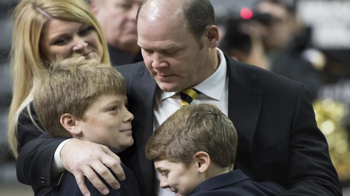 New Missouri football coach Barry Odom hugged his sons during his official introduction at Mizzou Arena on Friday in Columbia.