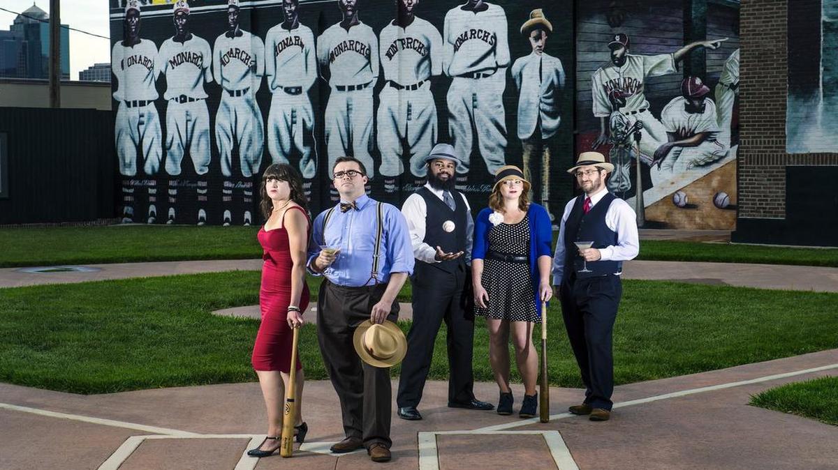 
Elizabeth Belden (left) and her brother Brad Belden showed off their “Dressed To The Nines” attire along with (back row, from left) Keith Kennedy, Ali Bush and Brett Parker on a small baseball diamond at 18th Street and Paseo Boulevard. Sunday is Dressed to the Nines Day at Kauffman Stadium, providing Kansas City Royals fans a chance to dress up and raise money for Negro Leagues Baseball Museum.
