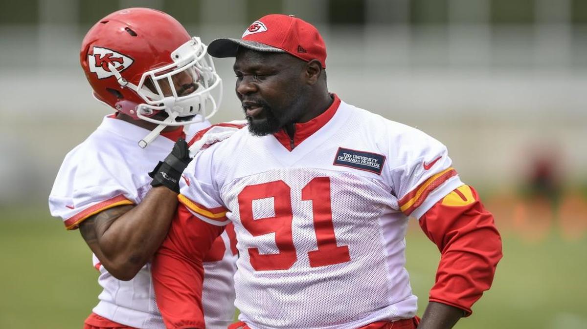 Chiefs linebacker Tamba Hali, left, shares a moment with another one of the team’s longest-tenured veterans, Derrick Johnson.
