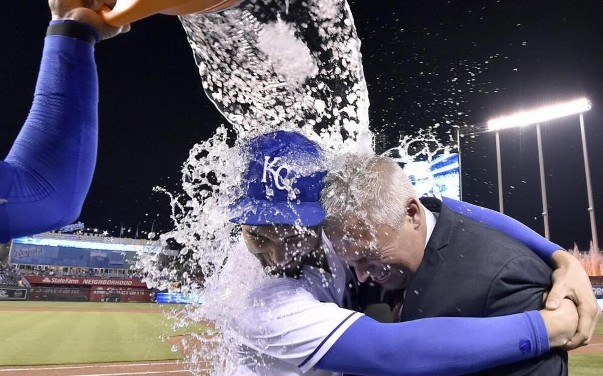 
Royals first baseman Eric Hosmer (left) made sure Fox Sports announcer Joel Goldberg couldn’t get away as Salvador Perez doused them while celebrating Kansas City’s 4-2 win over the Minnesota Twins on Tuesday night at Kauffman Stadium. The win ended a four-game losing streak for the Royals.

