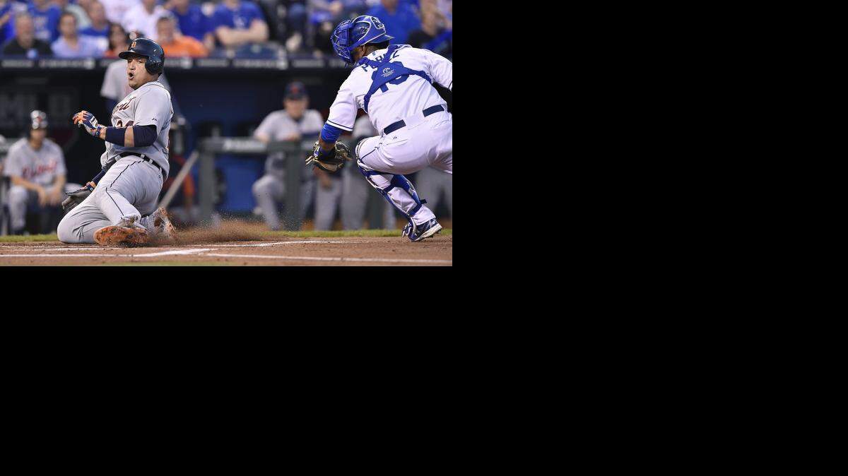 The Tigers' Miguel Cabrera avoided the tag of Royals catcher Salvador Perez as he scored on a single by Victor Martinez in the first inning of Friday's baseball game at Kauffman Stadium.