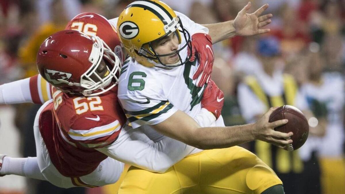 Chiefs linebacker Dadi Nicolas (left) sacked Packers quarterback Joe Callahan in the second quarter of Thursday’s preseason game at Arrowhead Stadium.