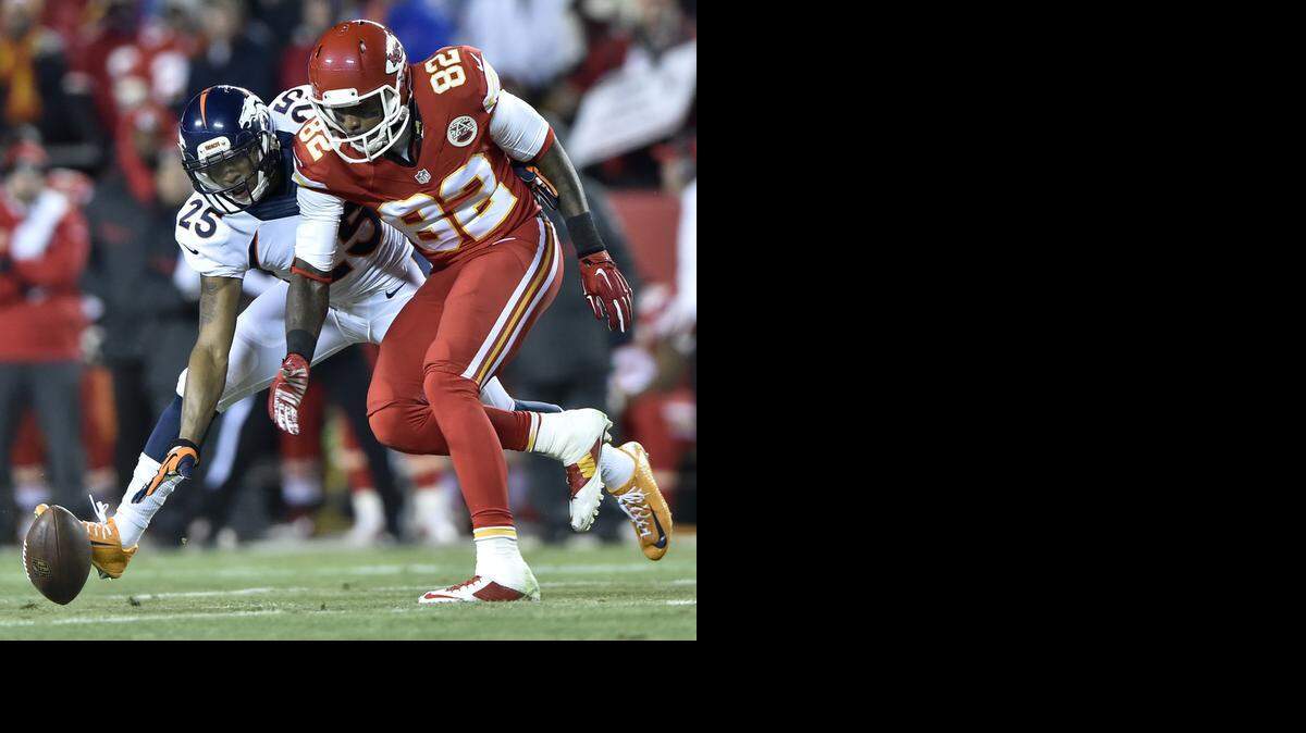 
Denver Broncos cornerback Chris Harris (25) breaks-up a pass intended for Kansas City Chiefs wide receiver Dwayne Bowe (82) in the first quarter during the Kansas City Chiefs and Denver Broncos football game at Arrowhead Stadium on Sunday, November 30, 2014, in Kansas City, Mo..
