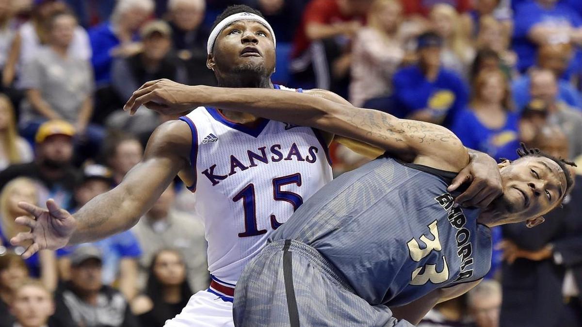 KU’s Carlton Bragg, left, battling Emporia State’s Terrance Sardin for position during Sunday’s exhibition game at Allen Fieldhouse, has the tools to take the Jayhawks places this season.
