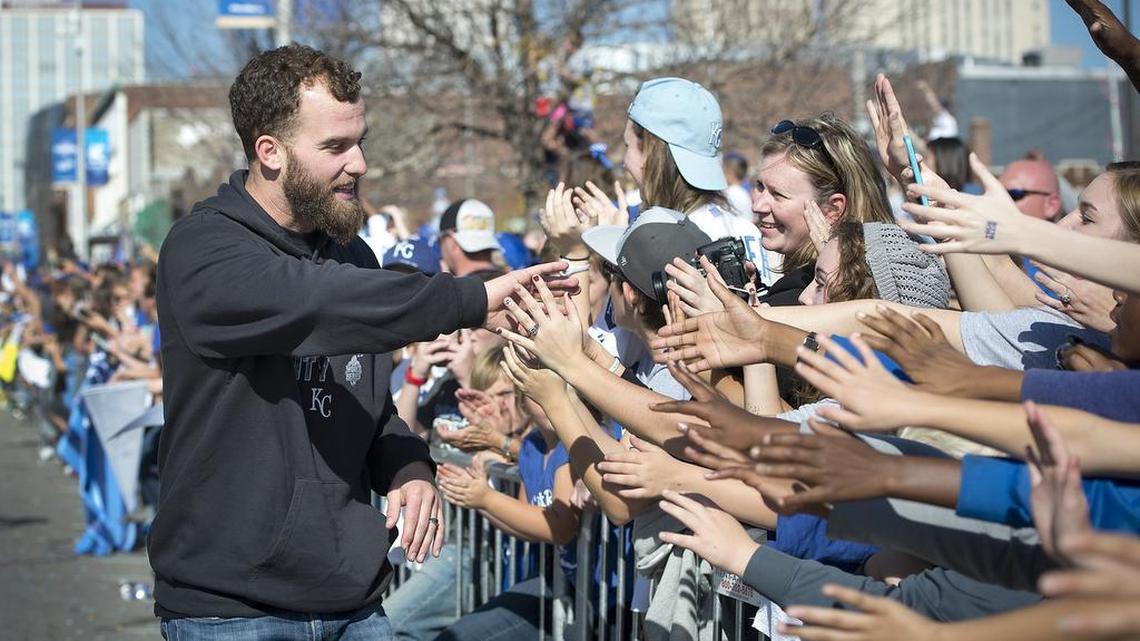 Royals pitcher Danny Duffy walked on the parade route to greet Royals fans that lined Grand Boulevard during the World Series victory parade on Tuesday in Kansas City.