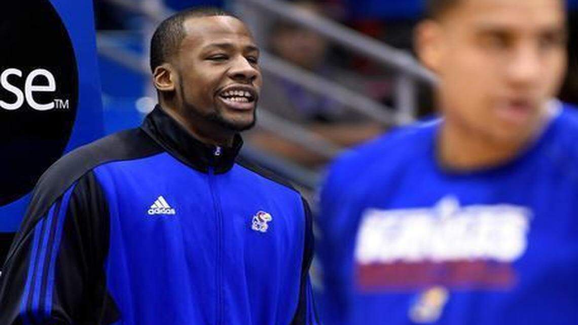 
KU's Cliff Alexander (left) watched his teammates warm up for Saturday’s game against Texas. Alexander did not suit up for the game after questions about his eligibility came up.
