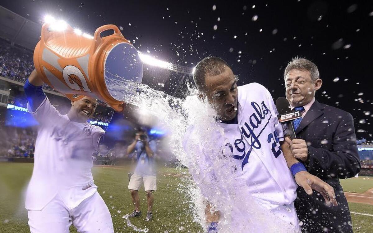 
Kansas City Royals designated hitter Kendrys Morales was doused in celebration after his game-winning hit Sunday in a game televised on ESPN.
