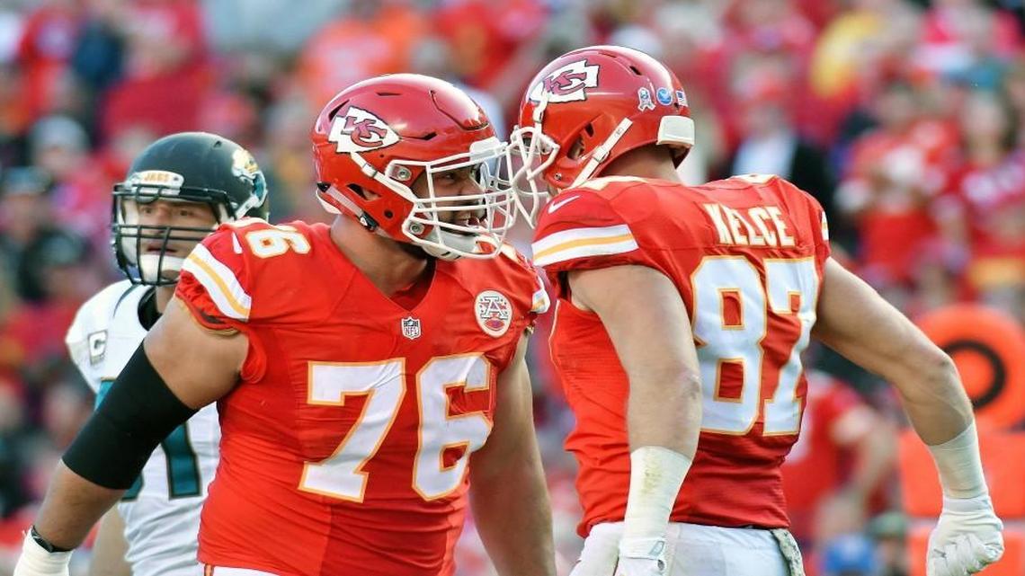 Chiefs guard Laurent Duvernay-Tardif, left, celebrates Travis Kelce’s fourth-quarter touchdown against the Jags with the soon-to-be ejected tight end on Sunday at Arrowhead Stadium.