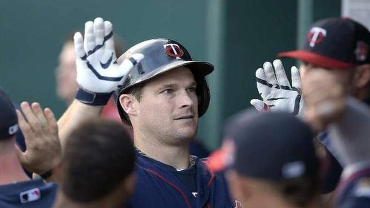
The Royals will welcome Josh Willingham (center) as much as the Twins welcomed him after he hit a homer against the Royals on July 30.


